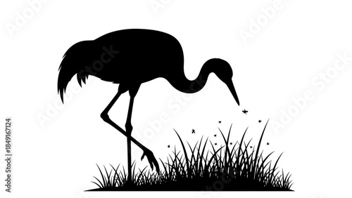 Silhouette of a heron standing in grass with delicate wing posture and scattered fireflies in a