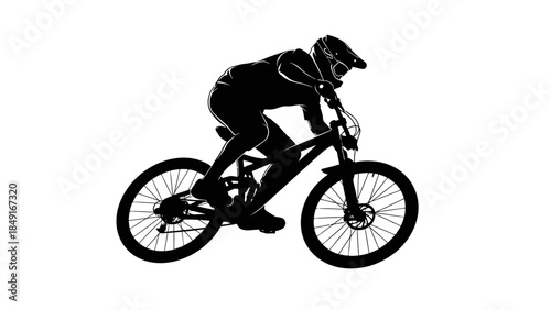 Silhouette of a mountain biker wearing protective gear riding a rugged trail bicycle during daytime