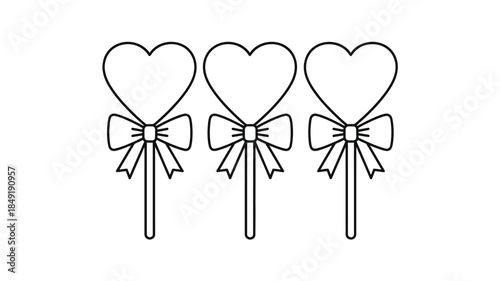 Three heart shaped lollipops with bows a charming black and white silhouette