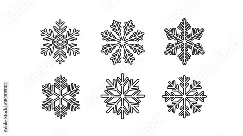 Intricate snowflake designs presented in a striking black and white silhouette