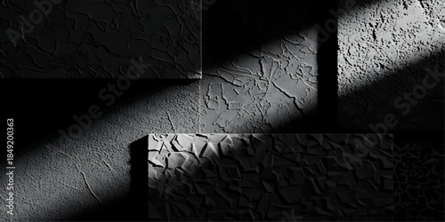 An empty dark room features a rough concrete floor and a vintage black and white grunge wall with a dirty aged stone texture for an old industrial interior backdrop design