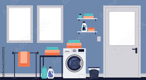 Modern laundry room interior with a washing machine folded towels detergents and blank picture frames on a blue wall.