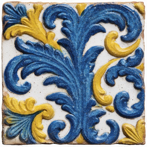 Ornate ceramic tile displays vibrant blue and yellow floral motifs, highlighting artistic craftsmanship and texture, ideal for enhancing interior spaces and decor themes
