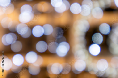 An abstract colorful background of warm-toned lights. In anticipation of Christmas and the holidays.