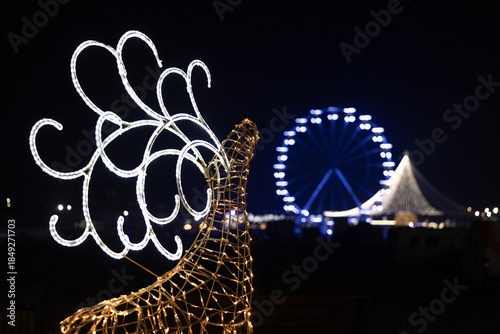 Defocused images of Christmas lights at a fair. 