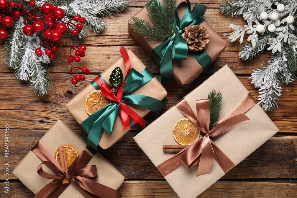 Fototapeta premium Gift boxes and Christmas decor on wooden table, flat lay