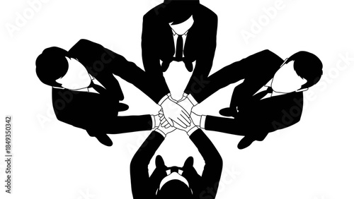 Business professionals in a circle stacking their hands in unity and cooperation in an office environment.