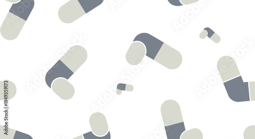 Gray and white medical capsules scattered.