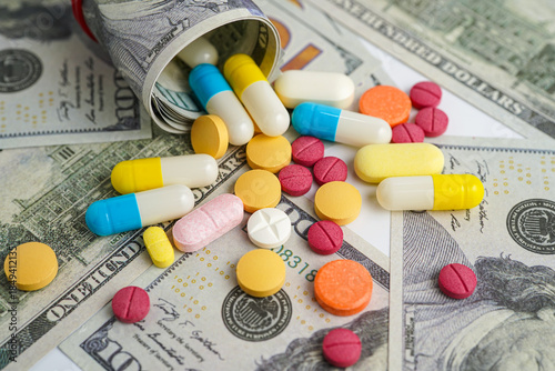 Pills on money dollars, Medicine prescription drugs cost concept, healthcare expenses