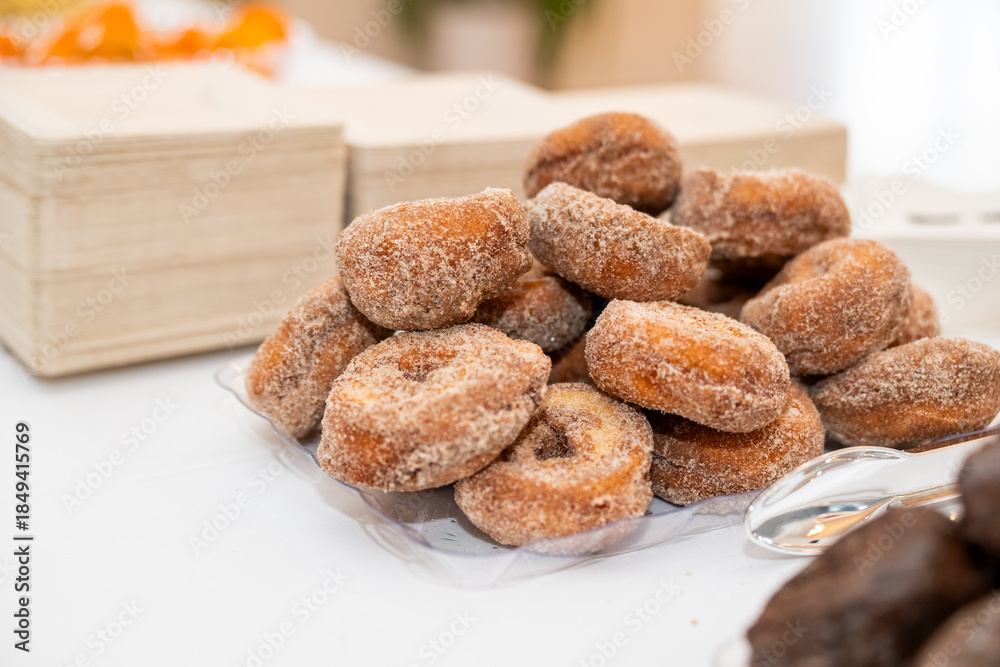 Fototapeta premium Stack of delicious fresh donuts on a plate 