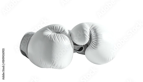 Two white leather boxing gloves, isolated against a dark background, in a close-up, studio shot