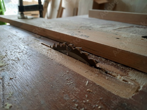 Table saw blade details for wood cutter machine. Carpentry tools in the woodworking area.