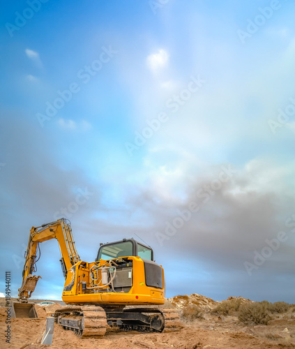 Excavator tractor seen from back with empty sky