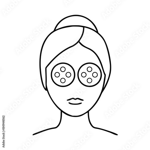 Woman receiving facial treatment with cucumber slices for relaxation and skincare routine