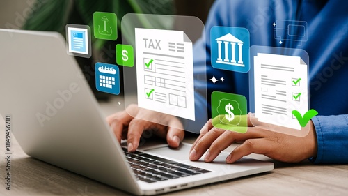 Person working on laptop with digital tax documents and icons floating above the keyboard