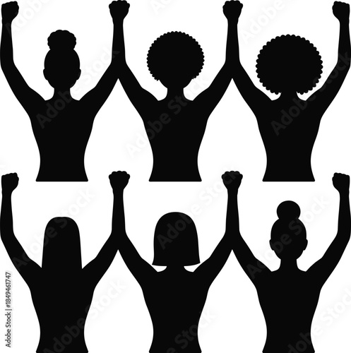 Diverse group of women silhouetted with raised fists in solidarity and empowerment