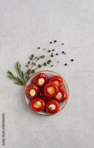 Red cherry peppers Sweet and spicy stuffed with cheese on ceramic plate. The milder 