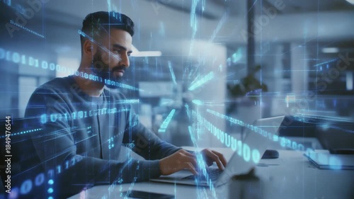Man working on a laptop with digital binary code and glowing abstract technological elements in an office environment