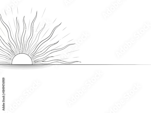 Sunrise with rays of light over a calm horizon line