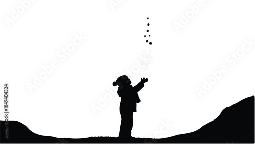 Child in silhouette reaching up to catch falling snow or stars in a winter landscape.