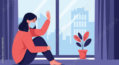 A lonely woman wearing a face mask sits by the window during quarantine, feeling isolated and sad during the pandemic.