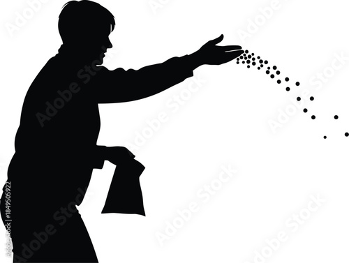 Silhouette of a person scattering seeds with an outstretched hand