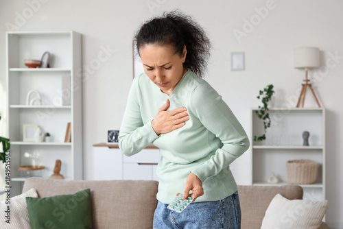 Mature woman with pills hav...