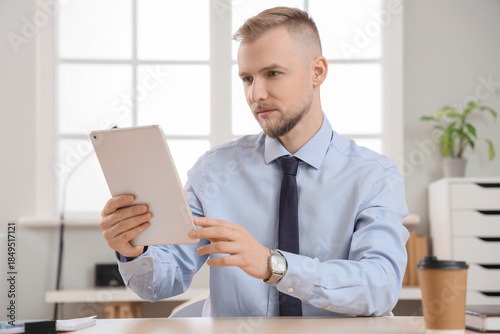 Bearded businessman working...