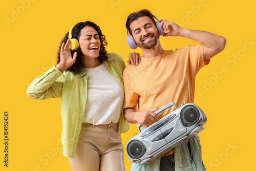Young couple in headphones ...