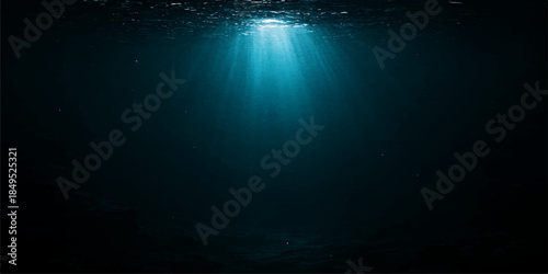 An abstract blue background featuring deep ocean waves and sunlight rays beaming through the water surface for a nature design texture