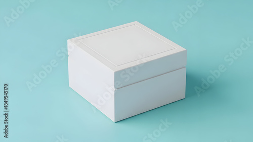 A white cube with a subtle shadow on a light blue background