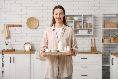 Young woman holding tray wi...