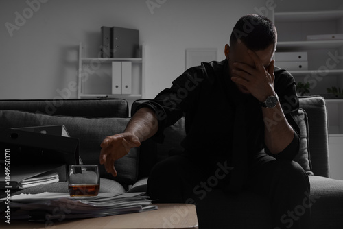 Businessman taking drink fr...