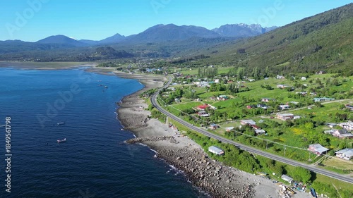 Puerto Montt, Chile: Aerial view of coastal road along pacific ocean in Puerto Montt, Lake District heading to carratera austral road, Chile with mountains in the background