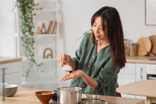 Young Asian woman preparing...