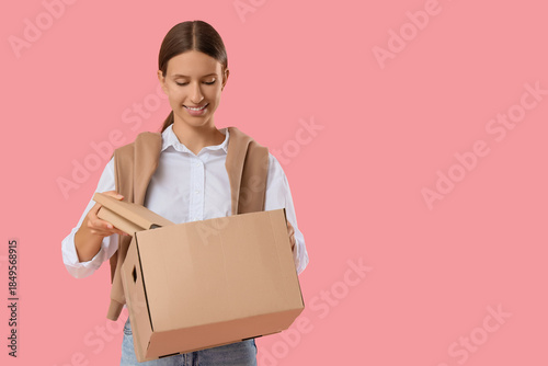 Young woman taking books fr...