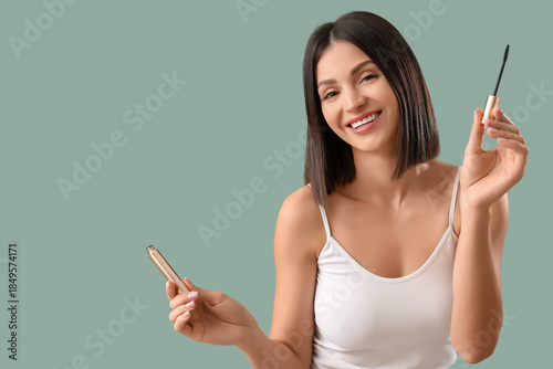 Young woman with mascara on...