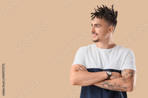 Young man with dreadlocks o...