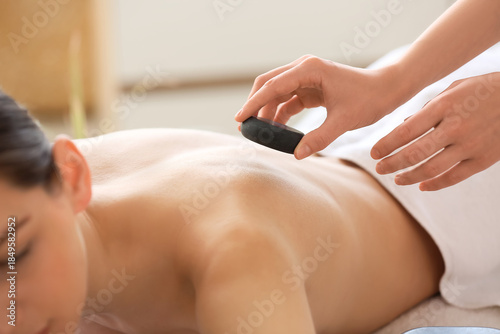 Young woman getting massage...