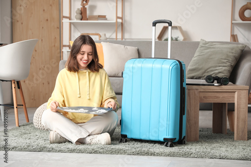 Young woman planning vacati...
