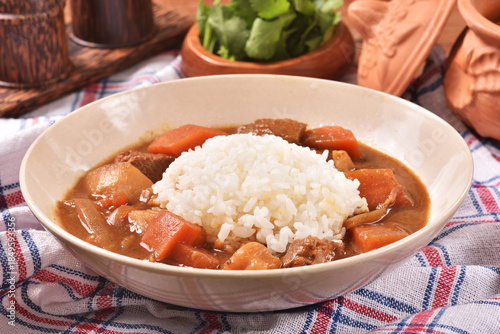 Pork curry with rice in a bowl
