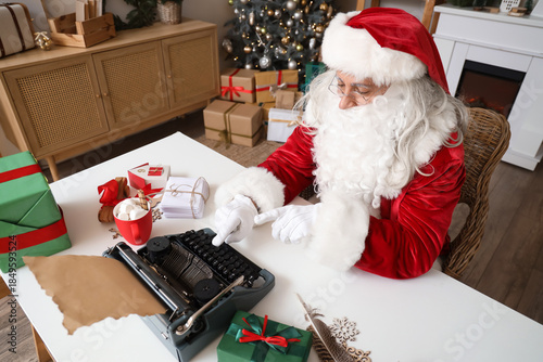 Santa Claus using typewrite...