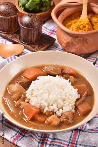 Pork curry with rice in a bowl