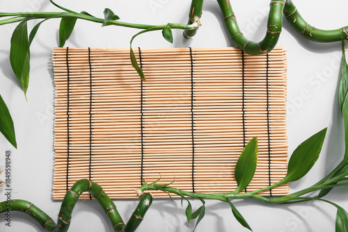 Green bamboo stems and mat ...