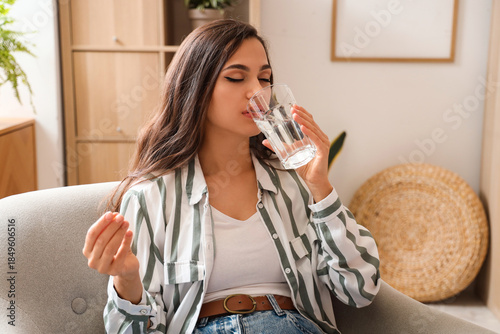 Young woman with glass of w...
