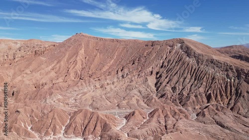San Pedro de Atacama, Chile: Cinematic forward aerial drone footage of rock formation of Mars valley in San Pedro de Atacama, Chile on sunny day in south America