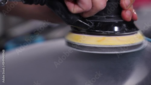Close-up of a Car Headlight Polishing. Auto Detailing.