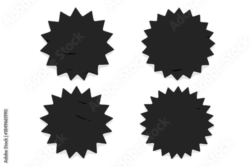 Four black crumpled paper starburst shapes on a dark background