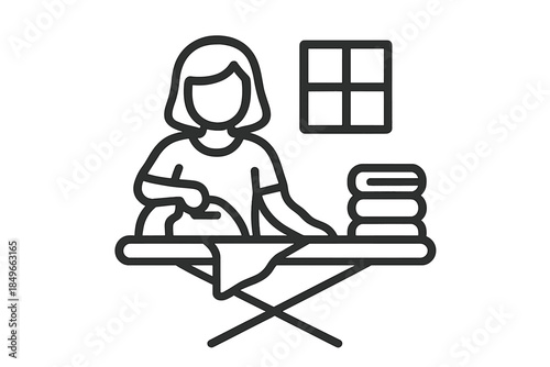 Woman ironing clothes with a stack of folded laundry next to a window