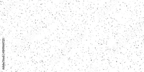 Abstract speckled texture with a subtle mosaic effect of scattered grey and white irregular shapes on a clean white background